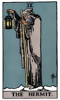 The Hermit tarot card (reversed)